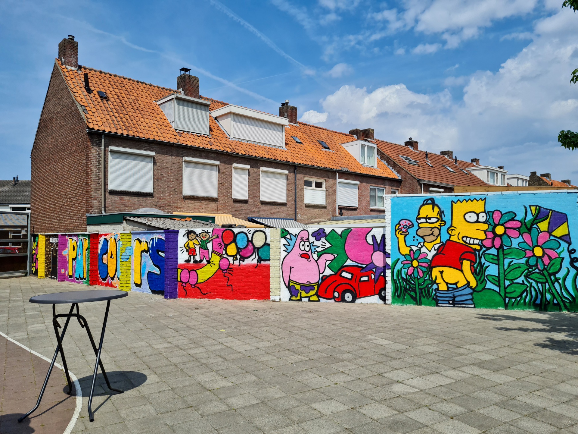 muurschildering Art-fact Buurtcultuur Tilburg Zuid schoolplein Parcours kunstenaar Atilla Yuksel