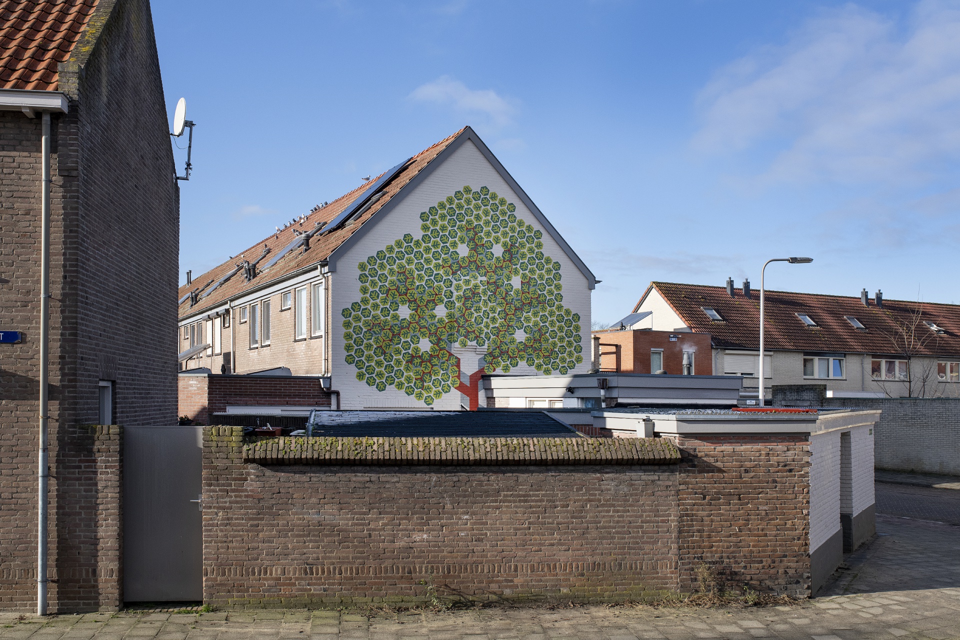 muurschildering Art-fact Buurtcultuur Tilburg Textielstraat Weverstraat kunstenaar Ton Lammers